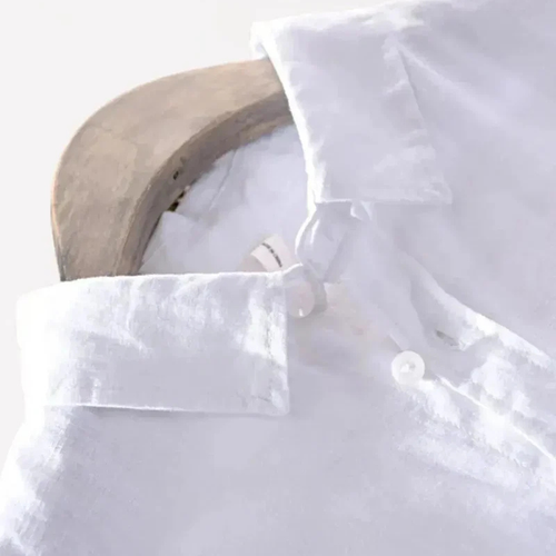 Saint Moritz Santorini linen short-sleeve shirt with a stylish design, showcased on a hanger against a neutral background.