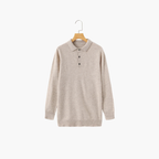 Saint Moritz 100% cashmere Kensington Classic Polo shirt in navy with a collared neckline and button front, displayed on a hanger.