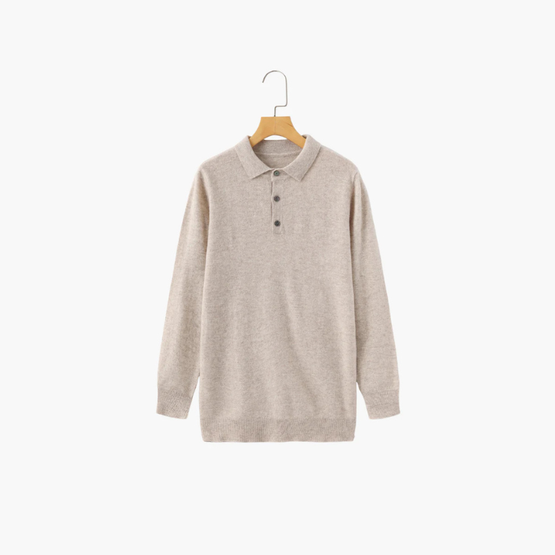 Saint Moritz 100% cashmere Kensington Classic Polo shirt in navy with a collared neckline and button front, displayed on a hanger.