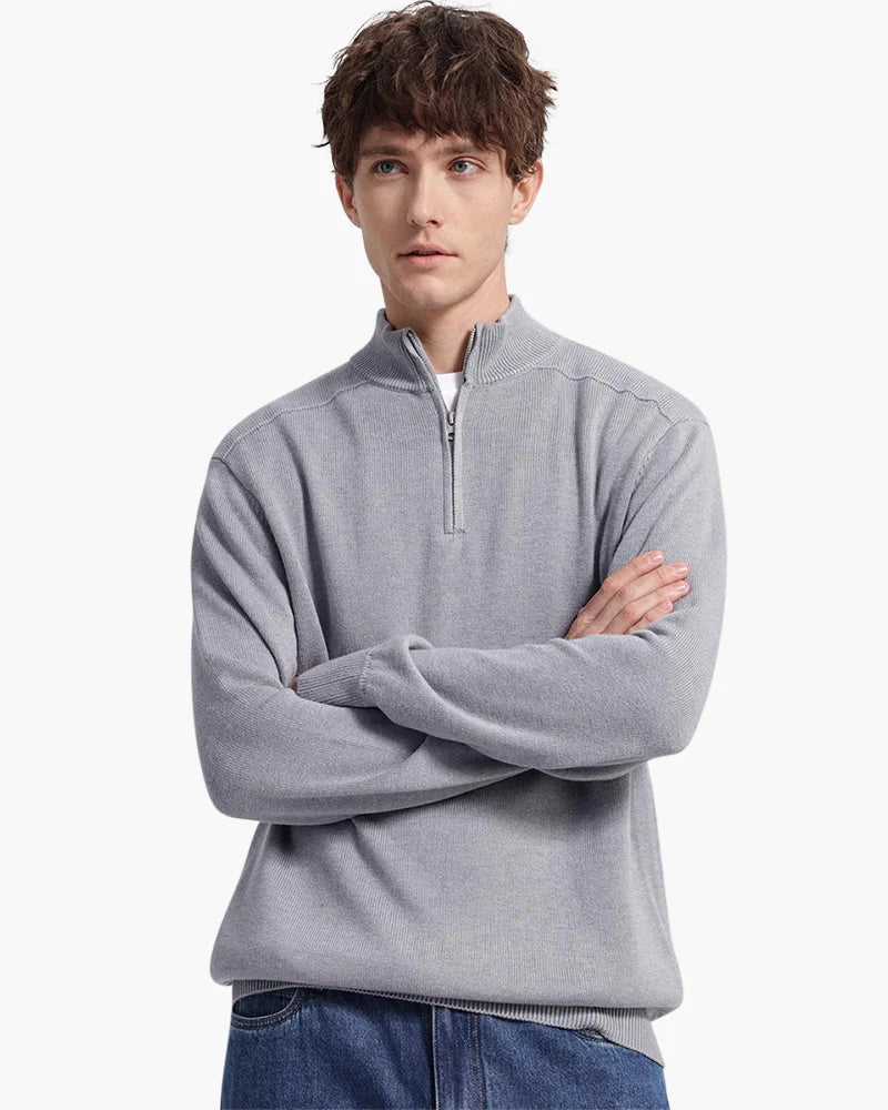 Saint Moritz Essential Winter Pullover, cozy knit sweater in neutral color, displayed on a hanger with a close-up of fabric texture.
