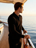 Saint Moritz 100% cashmere Kensington classic polo shirt, light blue with collar and buttons, displayed on a hanger.