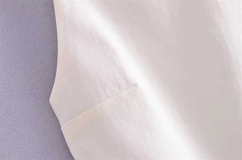 SAINT CLAIRE Celeste Cami Top in soft fabric with delicate straps, shown on a hanger against a neutral background.
