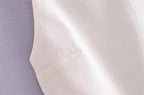SAINT CLAIRE Celeste Cami Top in soft fabric with delicate straps, shown on a hanger against a neutral background.