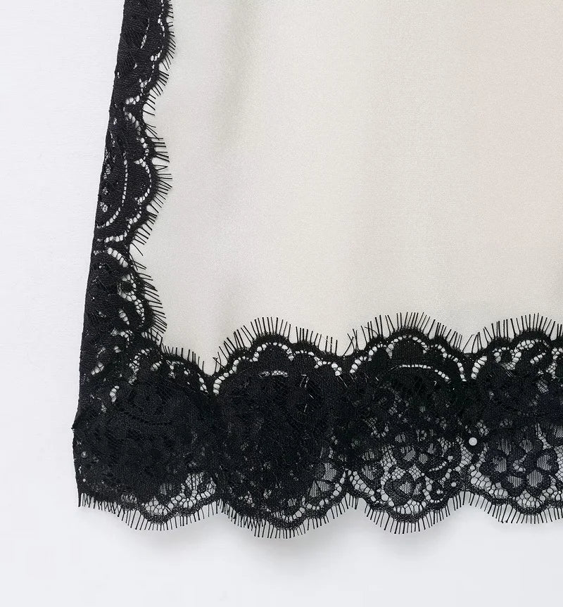SAINT CLAIRE velour lace camisole in soft fabric with delicate lace trim, shown on a hanger against a neutral background.