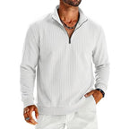 Saint Moritz Aspen Striped Half-Zip sweater featuring a cozy knit fabric and stylish striped pattern in neutral tones.