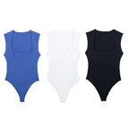 SAINT CLAIRE Épure Slim Bodysuit in black, snug fit with seamless design, displayed on a neutral background