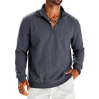 Saint Moritz Aspen striped half-zip sweater displayed on a hanger, featuring a classic design with bold stripes and a half-zip collar.