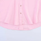 SAINT CLAIRE Sloane striped shirt featuring a classic pattern, button-down style, and long sleeves on a model.