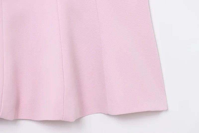 SAINT CLAIRE Épure backless top in soft fabric, shown on a model with a sleek, minimalist design and stylish backless cut.