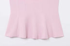 Saint Claire Épure backless top showing sleek design and fitted silhouette in a stylish, modern look.