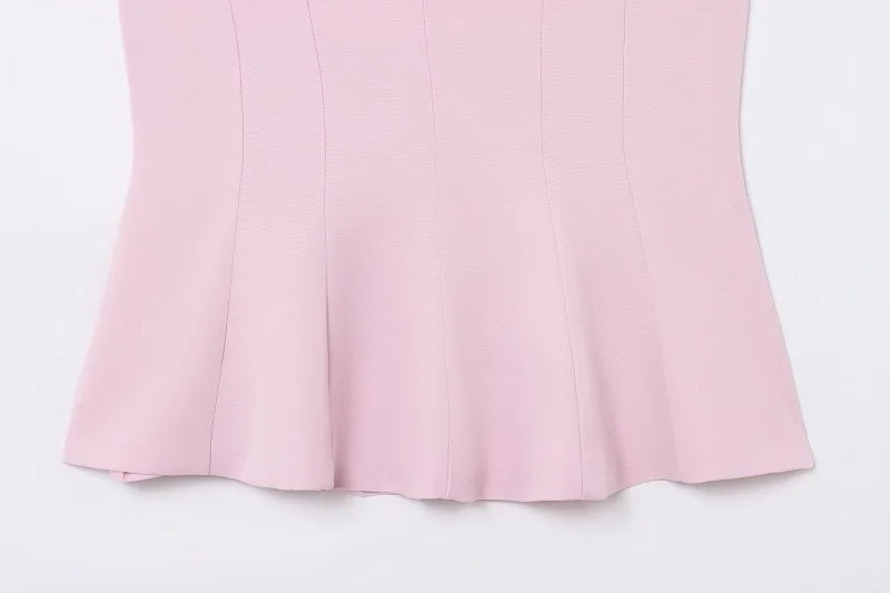 Saint Claire Épure backless top showing sleek design and fitted silhouette in a stylish, modern look.