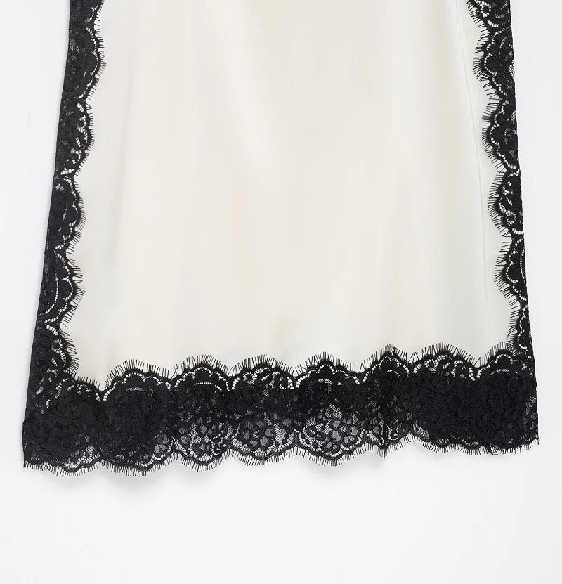 SAINT CLAIRE velour lace camisole featuring delicate lace details and soft velour fabric, displayed on a neutral background.