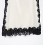 SAINT CLAIRE velour lace camisole featuring delicate lace details and soft velour fabric, displayed on a neutral background.