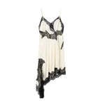 SAINT CLAIRE Selene asymmetrical mini dress in black, showcasing a stylish, fitted silhouette with unique hemline detail.