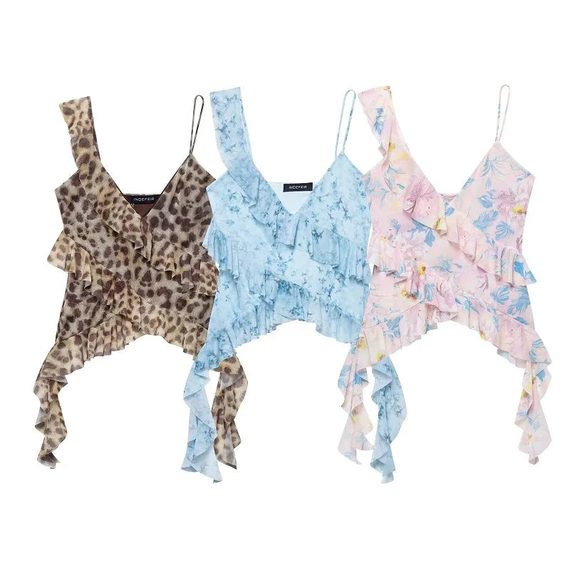 SAINT CLAIRE Marbella Statement Top displayed on a hanger, featuring vibrant fabric and stylish design for a bold fashion statement.