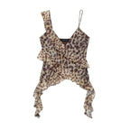 SAINT CLAIRE Marbella Statement Top showcasing a stylish, patterned blouse with ruffled details and vibrant colors.