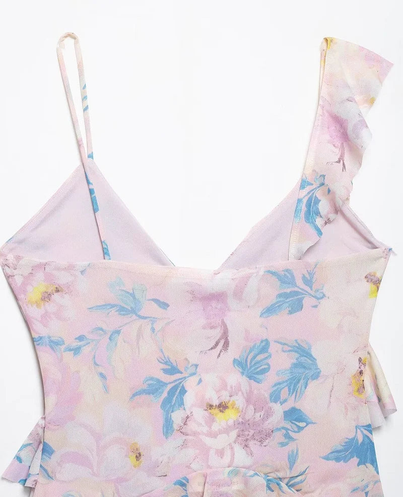 SAINT CLAIRE Marbella Statement Top displayed on a hanger, showcasing its stylish design and vibrant fabric.