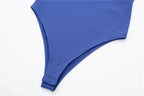 SAINT CLAIRE Épure Slim Bodysuit in black, close-up of the fitted, seamless design with high neckline and long sleeves.