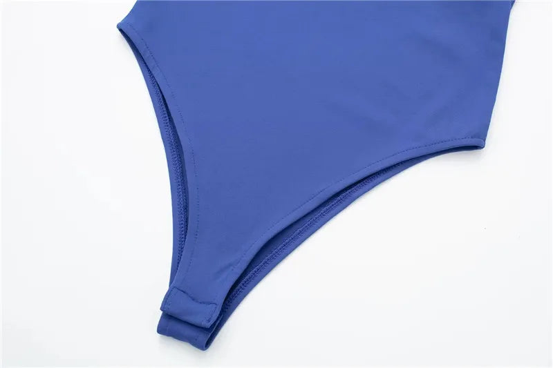 SAINT CLAIRE Épure Slim Bodysuit in black, close-up of the fitted, seamless design with high neckline and long sleeves.