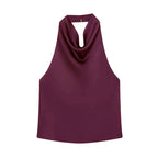 SAINT CLAIRE noir satin backless camisole showing smooth satin fabric and elegant backless design on a neutral background