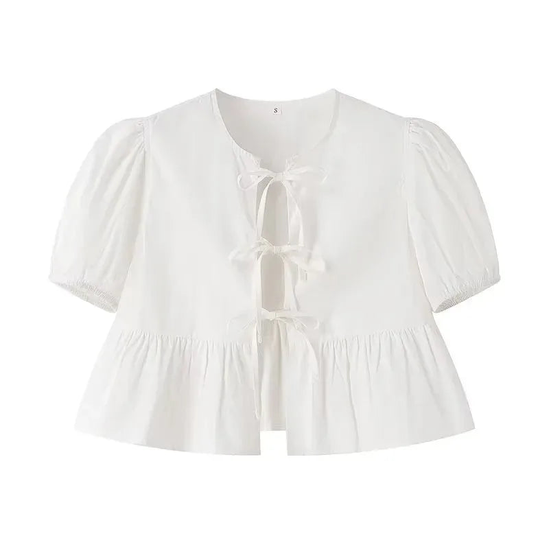SAINT CLAIRE Aurélie ruffle blouse in lightweight fabric with feminine ruffle details and long sleeves.