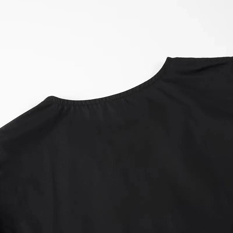 SAINT CLAIRE Aurélie Ruffle Blouse with feminine ruffle details and lightweight fabric, shown in a stylish white color.