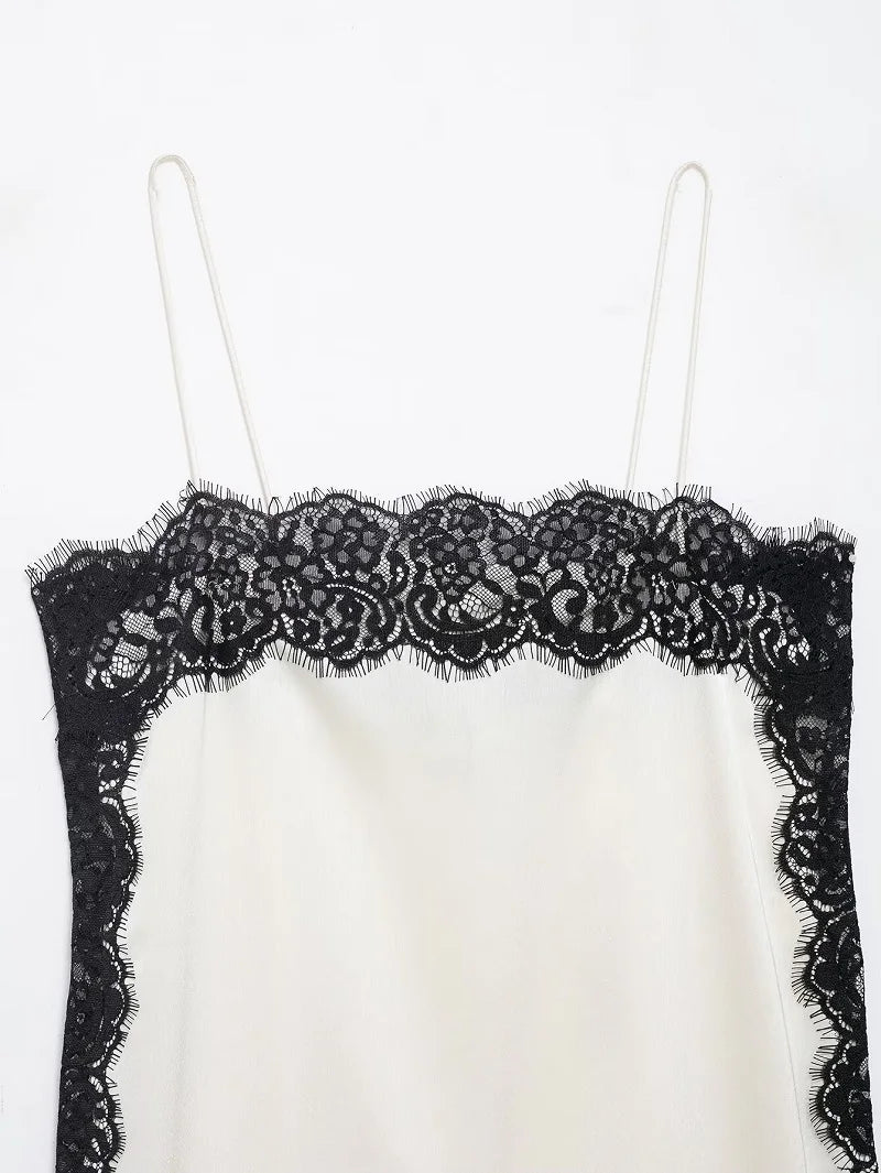 SAINT CLAIRE velour lace camisole featuring delicate lace details and soft velour fabric, shown in a close-up view.