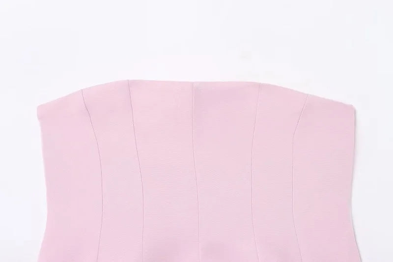 SAINT CLAIRE Épure backless top shown in black, featuring a sleek design with thin straps and a fitted silhouette.