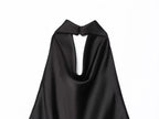 Saint Claire Noir Satin Backless Camisole displayed on a hanger, showcasing smooth satin fabric and backless design.