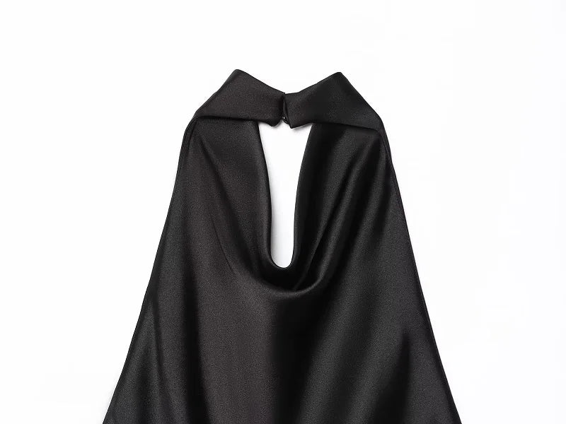 Saint Claire Noir Satin Backless Camisole displayed on a hanger, showcasing smooth satin fabric and backless design.