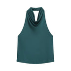 Saint Claire Noir satin backless camisole displayed on a hanger, showcasing its smooth satin fabric and elegant backless design.