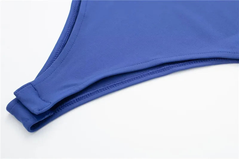 SAINT CLAIRE Épure Slim Bodysuit in black, close-up showing smooth fabric and fitted silhouette for a sleek, modern look.