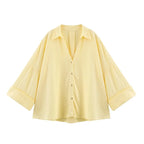 SAINT CLAIRE Sloane striped shirt featuring blue and white horizontal stripes, long sleeves, and classic collar.