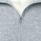 Saint Moritz Alpine zip-up knit jacket in cozy wool fabric, shown in a front view highlighting its stylish design and zipper details.