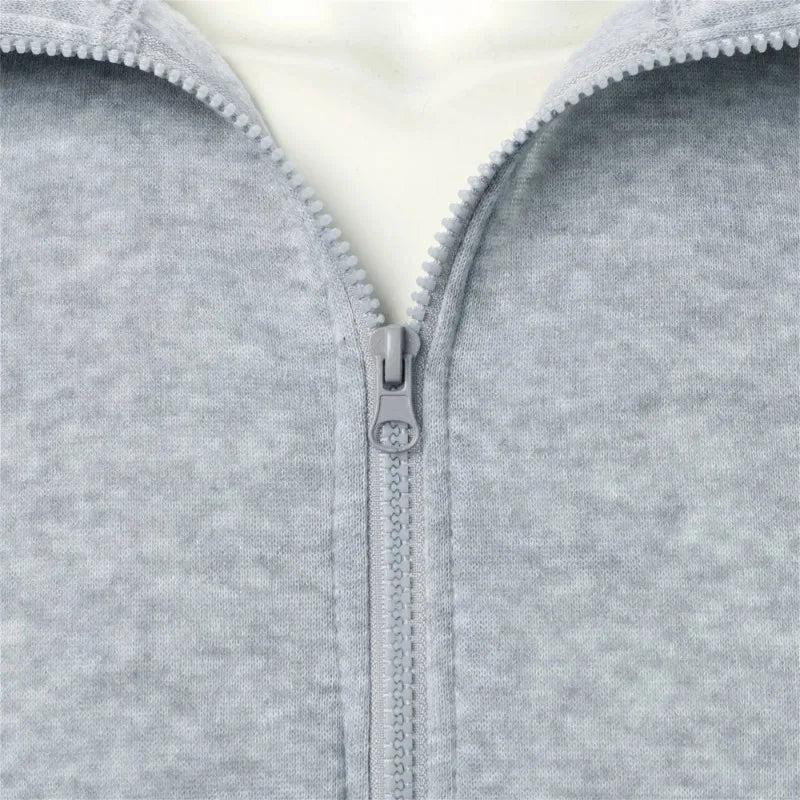Saint Moritz Alpine zip-up knit jacket in cozy wool fabric, shown in a front view highlighting its stylish design and zipper details.