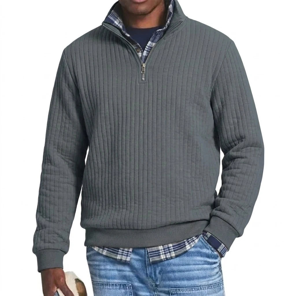 Saint Moritz striped quarter-zip sweater featuring a classic pattern and cozy fabric, worn by a model in a casual setting.