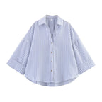 SAINT CLAIRE Sloane striped shirt with long sleeves, featuring blue and white horizontal stripes, casual button-up design.