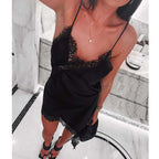 SAINT CLAIRE Selene asymmetrical mini dress in black, featuring stylish design and modern silhouette, visible on a model.