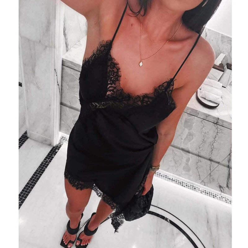 SAINT CLAIRE Selene asymmetrical mini dress in black, featuring stylish design and modern silhouette, visible on a model.