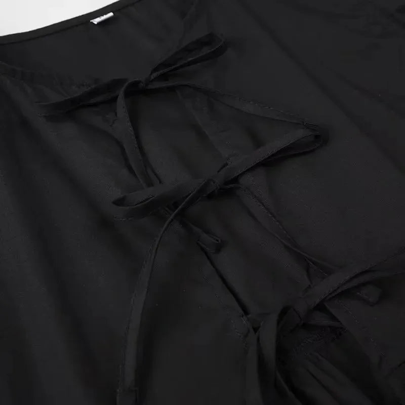 SAINT CLAIRE Aurélie Ruffle Blouse with delicate fabric and ruffled details, modeled on a mannequin.