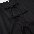 SAINT CLAIRE Aurélie Ruffle Blouse with delicate fabric and ruffled details, modeled on a mannequin.