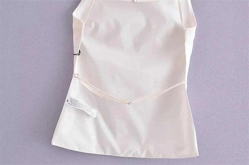 SAINT CLAIRE Celeste Cami Top in soft fabric, featuring a fitted design and thin straps, shown on a neutral background.