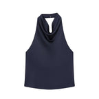 SAINT CLAIRE Noir satin backless camisole with smooth fabric and delicate straps, displayed on a neutral background.