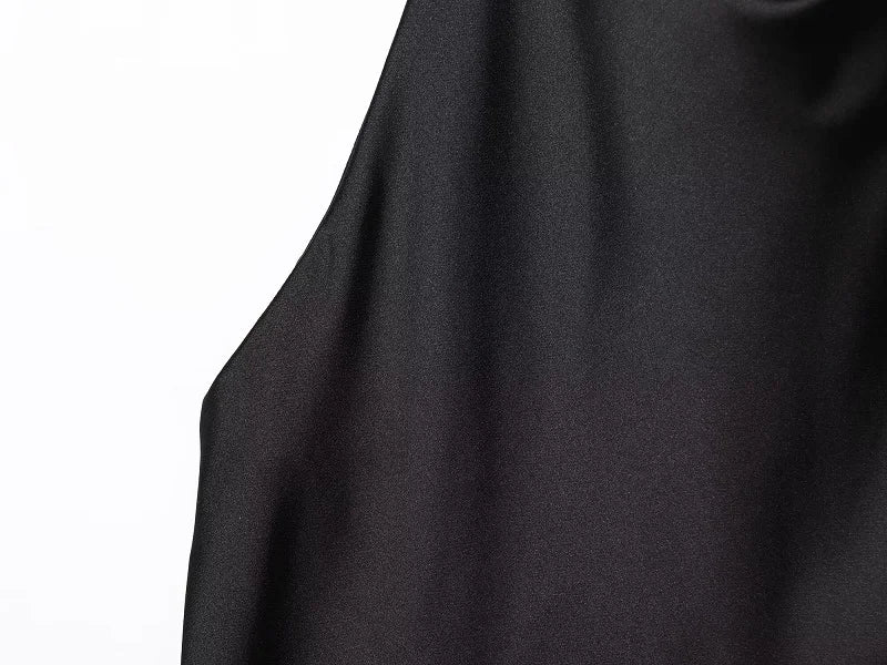 Black satin backless camisole by SAINT CLAIRE featuring a sleek, satin finish and delicate straps for an elegant look.